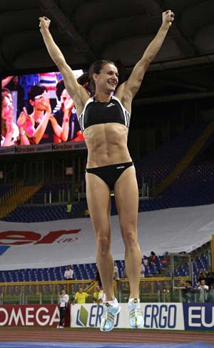 Yelena Isinbaeva of Russia reacts after setting a new world record in the women's pole vault during the Golden Gala IAAF Golden League at the Olympic stadium in Rome July 11, 2008.