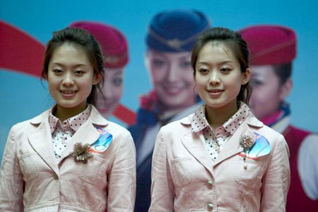 Twin sisters participate in the Southern Airline's stewardess enrollment contest. 
