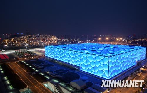 Olympic venues like the Bird's Nest and Water Cube adopt energy-saving technologies. Photos here are taken on July 13.