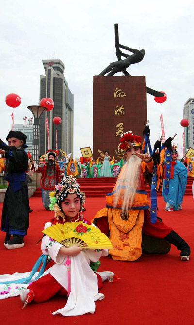Little performers dance during the launching ceremony of 2008 Beijing Olympic Games torch relay in Jilin City, northeast China's Jilin Province, on July 15, 2008. 