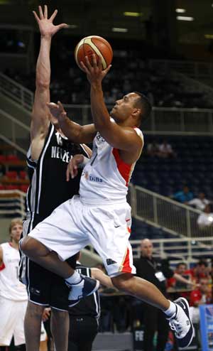Germany's Robert Garrett (R) jumps for a lay up against New Zealand's Craig Bradshaw during their basketball game at FIBA Olympic qualifying tournament in Athens July 16, 2008.