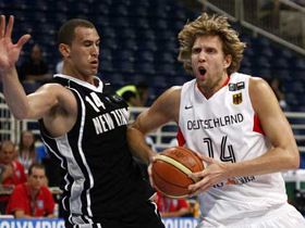 Germany's Dirk Nowitzki (R) is challenged by New Zealand's Craig Bradshaw during their basketball game at FIBA Olympic qualifying tournament in Athens July 16, 2008.Nowitzki scored 35 points and led Germany to an 89-71 victory over New Zealand.