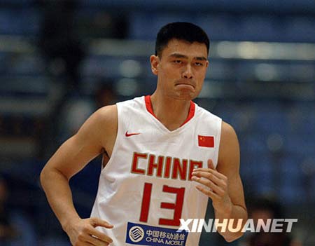 Chinese basketball star Yao Ming, 2.28m Houston Rockets center, plays during the match against Serbia at the Stankovic Cup basketball Olympic warmup tournament in Hangzhou, capital of east China's Zhejiang Province, July, 17, 2008. 