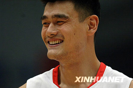 Chinese basketball star Yao Ming smiles during the match against Serbia at the Stankovic Cup basketball Olympic warmup tournament in Hangzhou, capital of east China's Zhejiang Province, July, 17, 2008. 