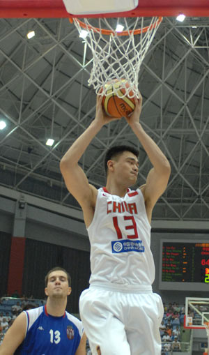 China's Yao Ming (Top) grabs a rebound during the game against Serbia at the Stankovic Cup basketball Olympic warmup tournament in Hangzhou, capital of east China's Zhejiang Province, July, 17, 2008.