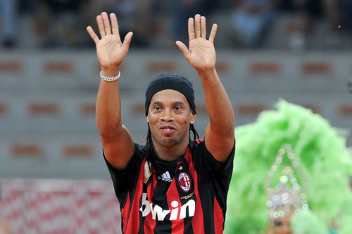  who wore a Milan kit as he waved to the crowd from the pitch.