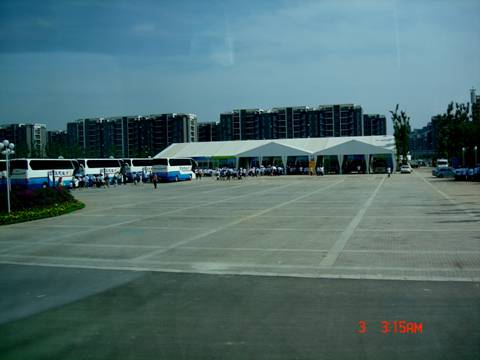 Those white tents are the first gate to the Olympic Village. 