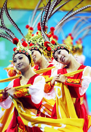 Performers render Chinese traditional folk dance during a conference to display sport presentations and awarding ceremonies of the 2008 Beijing Olympic Games in the gym of Beijing Institute of Technology in Beijing, on July 20, 2008. (Xinhua Photo)