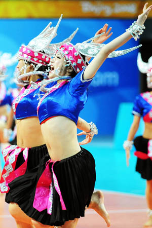 Performers render Chinese traditional folk dance during a conference to display sport presentations and awarding ceremonies of the 2008 Beijing Olympic Games in the gym of Beijing Institute of Technology in Beijing, on July 20, 2008.(Xinhua Photo)