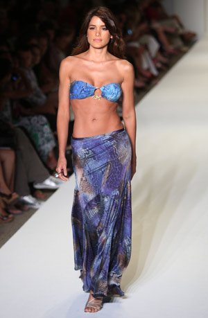 A model walks the runway wearing ANK swimwear 2009 collection by designer Mirla Sabino during Mercedes-Benz Fashion Week Swim show in Miami July 19, 2008. 