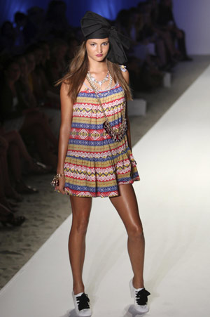 A model walks the runway wearing Zimmermann swimwear 2009 collection by designer Nicky Zimmermann during Mercedes-Benz Fashion Week Swim show in Miami July 19, 2008.