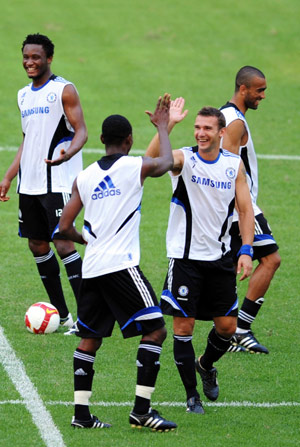 Andriy Shevchenko (R Front) of Chelsea celebrates a goal with a teammate during a training session in Guangzhou, capital of south China's Guangdong Province, July 21, 2008. Chelsea arrived in Guangzhou Monday to kick off their Asian tour. They will play against China's Guangzhou Pharmaceutical on July 23.
