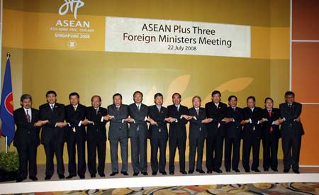 Foreign Ministers and representatives to the Association of Southeast Asian Nations (ASEAN) plus three foreign ministers meeting hold hands during the meeting in Singapore July 22, 2008. Foreign ministers from the ASEAN countries and China, Japan and South Korea attended the meeting here on Tuesday. 