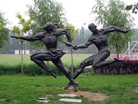 A photo taken on July 18, 2008 shows a sculpture named 'The Relay' in the Qinhuangdao Olympic Park in north China's Hebei Province. This theme park featuring Olympic Games has a music fountain and Olympic sculptures.