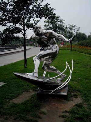 A photo taken on July 18, 2008 shows a sculpture named 'Surfing' in the Qinhuangdao Olympic Park in north China's Hebei Province. This theme park featuring Olympic Games has a music fountain and Olympic sculptures.