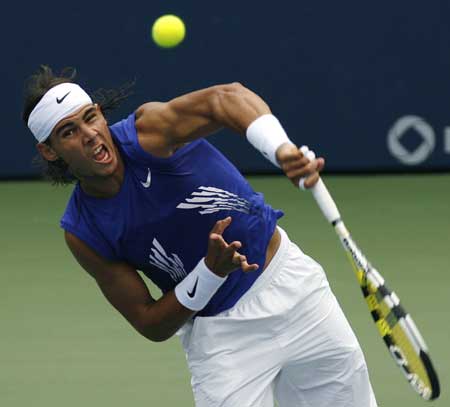 Rafael Nadal of Spain follows through on a serve against Nicolas Kiefer of Germany during their Men's Singles Final at the Rogers Cup tennis tournament in Toronto on July 27, 2008.(Xinhua/Reuters Photo)