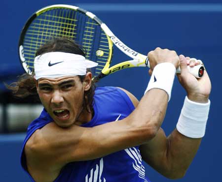 Rafael Nadal of Spain follows through on a shot against Nicolas Kiefer of Germany during their Men's Singles Final at the Rogers Cup tennis tournament in Toronto on July 27, 2008.(Xinhua/Reuters Photo)