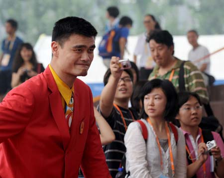 Chinese basketball player Yao Ming attends the flag-raising ceremony of the Chinese delegation at the Olympic Village, in Beijing, China, July 27, 2008. The Chinese delegation held the first flag-raising ceremony here on Sunday morning after the village officially opened to athletes.