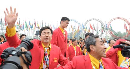 Chinese basketball player Yao Ming attends the flag-raising ceremony of the Chinese delegation at the Olympic Village, in Beijing, China, July 27, 2008. The Chinese delegation held the first flag-raising ceremony here on Sunday morning after the village officially opened to athletes.