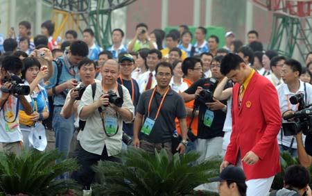 Chinese basketball player Yao Ming attends the flag-raising ceremony of the Chinese delegation at the Olympic Village, in Beijing, China, July 27, 2008. The Chinese delegation held the first flag-raising ceremony here on Sunday morning after the village officially opened to athletes. 