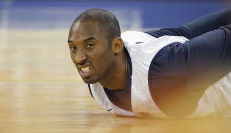 U.S. basketball team player Kobe Bryant stretches during a training session for the Beijing Olympics at the Venetian Macao-Resort-Hotel in Macau on July 29, 2008. 