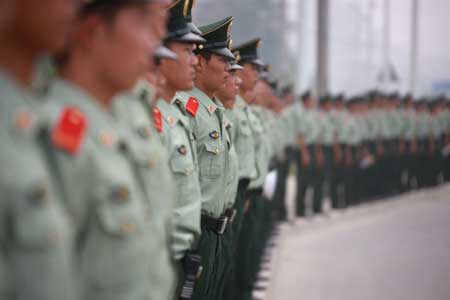 The armed police gather for orders during the training exercise in Beijing, captial of China, July 28, 2008. The armed police responsible for the security of the Beijing 2008 Olympic Games implement strict training as Olympics near.