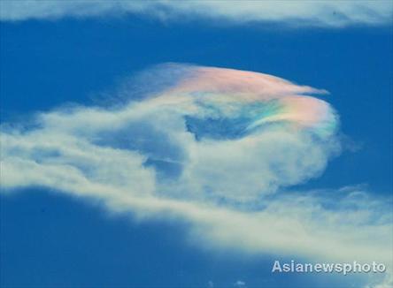 A colorful cloud ring is seen in the sky over a section of highway between Kailidong and Guiding, Southwest China&apos;s Guizhou Province at 19:59 pm on July 27, 2008.