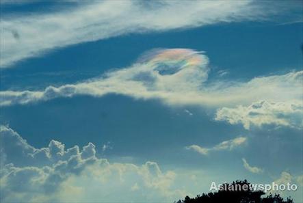 A colorful cloud ring is seen in the sky over a section of highway between Kailidong and Guiding, Southwest China&apos;s Guizhou Province at 19:59 pm on July 27, 2008.
