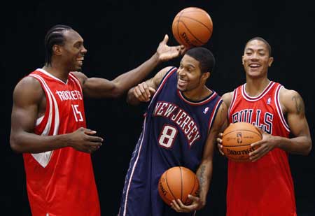 Former University of Memphis players and now NBA rookies (R-L) Derrick Rose of the Chicago Bulls, Chris Douglas-Roberts of the New Jersey Nets and Joey Dorsey of the Houston Rockets joke together before being photographed by the trading card company Upper Deck during the NBA 2008 Rookie Photo Shoot in Tarrytown, New York, July 29, 2008. 