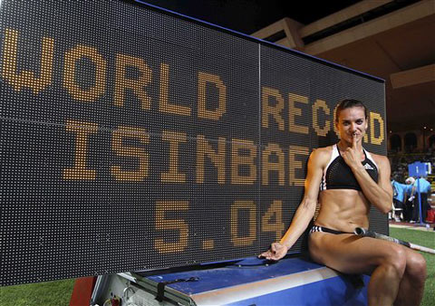 Russian Yelena Isinbayeva flew over a new world record of 5.04 meters in the women's pole vault competition of the Super Grand Prix meeting on Tuesday.