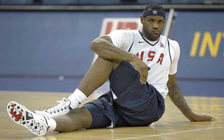 U.S. basketball team player LeBron James stretches during a training session for the Beijing Olympics at the Venetian Macao-Resort-Hotel in Macau July 30, 2008.