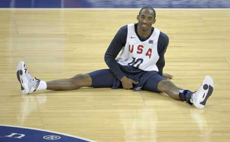 U.S. basketball team player Kobe Bryant stretches during a training session for the Beijing Olympics at the Venetian Macao-Resort-Hotel in Macau July 30, 2008.