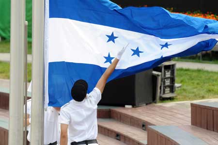 The national flag of Honduras is raised up at the Olympic Village in Beijing, China, July 30, 2008. The Honduran delegation to Beijing 2008 Olympic Games held flag-raising ceremony at Olympic Village on Wednesday morning. (Xinhua/Yang Lei)