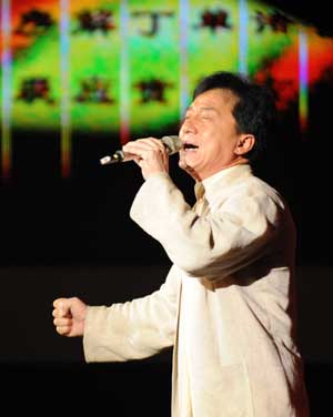 Chinese film star Jackie Chan sings at an evening party which is held for the upcoming 2008 Beijing Olympic Games in Beijing, capital of China, on July 29, 2008. 