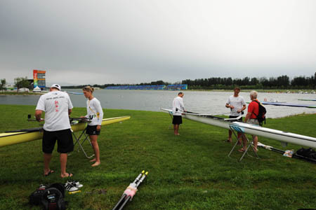 Rowing athletes of New Zealand adjust their boats before training in Sunyi Olympic Rowing-Canoeing Park in Beijing, July 29, 2008. Athletes from 10-plus countries and regions gear up for Beijing Olympics in the park on Tuesday. During the Beijing 2008 Olympic Games, the park will host the Rowing, Canoe/Kayak Flatwater, Canoe/Kayak Slalom and Marathon Swimming events. (Xinhua/Jiang Enyu)