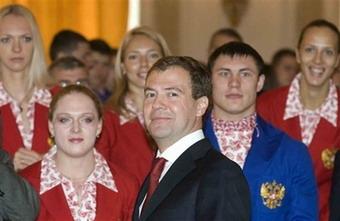Russian President Dmitry Medvedev, center, is seen meeting the Russian Olympic team in the Moscow Kremlin, Tuesday, July 29, 2008.