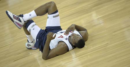 U.S. basketball team player Dwight Howard stretches during a training session for the Beijing Olympics at the Venetian Macao-Resort-Hotel in Macau July 30, 2008. 