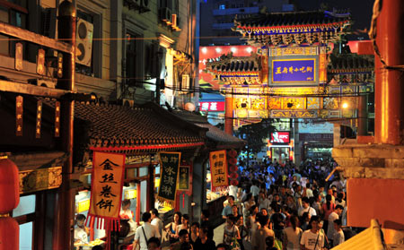  Photo taken on July 29, 2008 shows the night view of Wangfujing snack street in Beijing, capital of China. In the past, the popular Beijing snacks used to be hawked at temple fairs or roadside bazaars. Along with the change of times, traditional Beijing snack bars have emerged in streets and lanes of the city. There are also some snack streets with business of traditional Beijing snacks and other flavor snacks from around China that favor lots of local residents and tourists. 