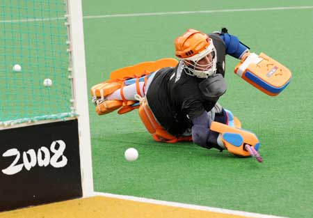 A Dutch women's hockey team player trains at the Olympic Green Hockey Stadium in Beijing, capital of China, July 31, 2008.[Xinhua]