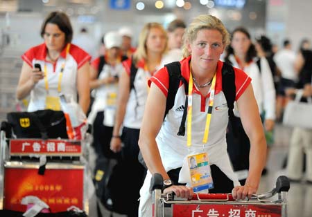 German Olympic women&apos;s football team players arrive at the Taoxian International Airport of Olympic co-host city Shenyang, capital of northeast China&apos;s Liaoning Province, July 31, 2008.[