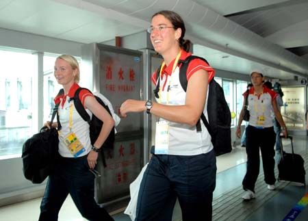 German Olympic women&apos;s football team players arrive at the Taoxian International Airport of Olympic co-host city Shenyang, capital of northeast China&apos;s Liaoning Province, July 31, 2008. 