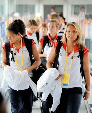 German Olympic women&apos;s football team players arrive at the Taoxian International Airport in Shenyang, capital of northeast China&apos;s Liaoning Province, July 31, 2008.(