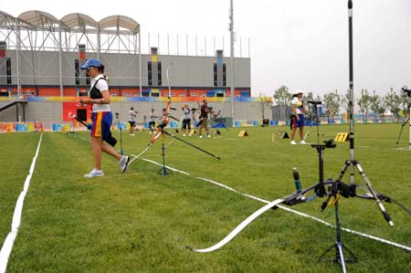 Archer Natalia Sanchez (L) of Colombia takes part in a training session at the Olympic Green Archery Field in Beijing, China, July 31, 2008. Archers started their applicability training sessions after their arrivals in Beijing. (Xinhua/Zhang Ling) 