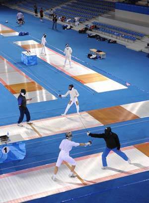 Members of the Olympic fencing teams practice during a training session inside the Fencing Hall of the National Convention Center, in Beijing July 30, 2008. 