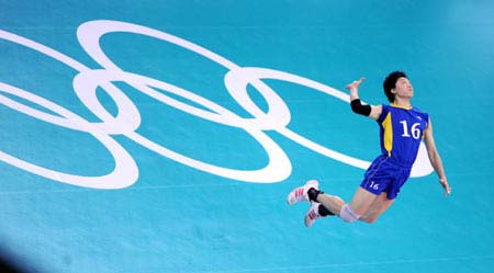 An Olympic volleyball player spikes the ball during a training session at the Capital Indoor Stadium, in Beijing, July 30, 2008. The venue will host the volleyball events for the 2008 Olympic Games.