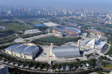 The aerial photo taken on August 2, 2008 shows the Yingdong natatorium and Olympic Sports Center Gymnasium in Beijing, China. The water polo, handball and modern pentathlon competitions of the Beijing 2008 Olympic Games will be held there. (Xinhua/Guo Dayue)