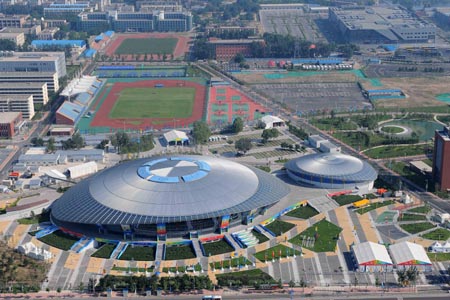 The aerial photo taken on August 2, 2008 shows the Beijing University of Technology Gymnasium in Beijing, China. The badminton and rhythmic gymnastics competitions of the Beijing 2008 Olympic Games will be held there. (Xinhua/Chen kai)