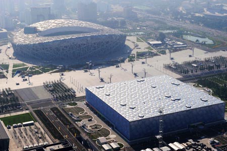The aerial photo taken on August 2, 2008 shows the National Stadium and the National Aquatics Center, namely the Bird's Nest and Water Cube in Beijing, China. (Xinhua/Guo Dayue)