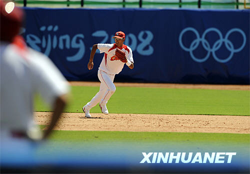 A baseballer is practising running bases [Xinhua]