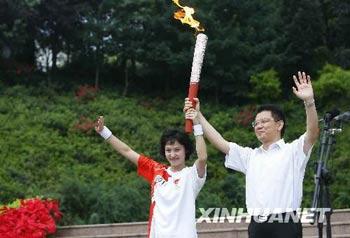 The Olympic torch is carrying through Leshan, Sichuan province.